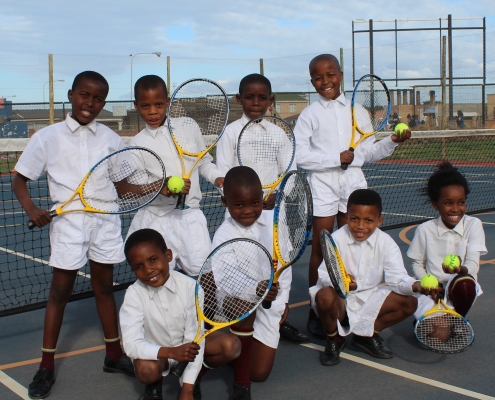 Kids playing tennis in South Africa